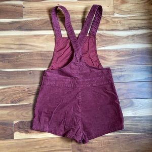 Women’s corduroy burgundy overalls.
